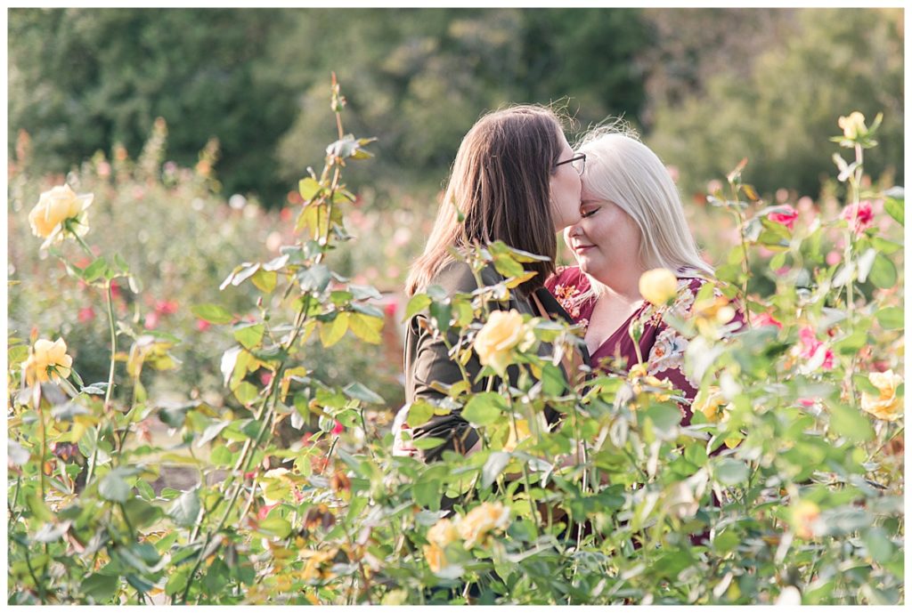 a female couple in the midst of flowers 